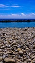 Pioppi beach, Cilento, Campania, Italy. Pebbles, blue sea and blue sky