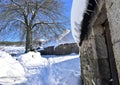 Piornedo, Ancares, Galicia, Spain. Ancient snowy palloza houses made with stone and straw. Village covered with snow. Royalty Free Stock Photo