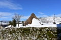 Piornedo, Ancares, Lugo Province, Galicia, Spain. Ancient snowy palloza house made with stone and straw.