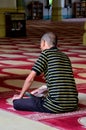 Muslim man reads Koran inside mosque