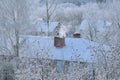 Pipe or chimney on the roof of a brick house. Royalty Free Stock Photo