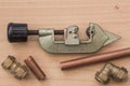 Pipe cutter with copper pipe and compression fittings.