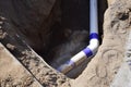 Pipe in a ditch in the ground Royalty Free Stock Photo