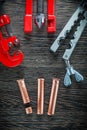 Pipe flaring tool set on wooden board Royalty Free Stock Photo