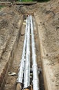 Pipe insulation. Breakthrough sewerage system.Pipes for water in an earthen trench. Royalty Free Stock Photo