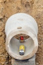 Pipe laser installed inside concrete pipe by site engineer to provide correct line and gradient for pipelayers. Laying drainage