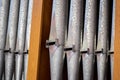 Pipe organ metal pipes in a row up close detail nobody. Religious music service, pipe organ musical concert, classical music Royalty Free Stock Photo