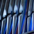 Pipe organ 7 pipes blue and silver Royalty Free Stock Photo