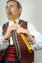 Pipe player in traditional clothing