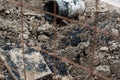 Pipe repair site through a metal fence