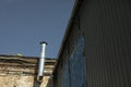 Pipe on roof. Steel pipe on building. Details of industrial area Royalty Free Stock Photo