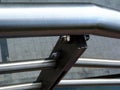pipe stainless steel handrail close-up detail with soft blurred background Royalty Free Stock Photo