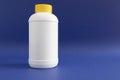 Pipe Unclogging Granules In Yellow Cap, White Plastic Bottle On Blue Purple Background