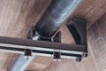 Pipe under a concrete bridge with dampers and steel support Royalty Free Stock Photo