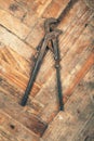 Pipe wrench on wooden floor Royalty Free Stock Photo