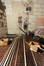 Pipefitter installing system of heating or underfloor heating installation. Water floor heating system interior