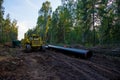 Pipelayer with side boom Installation of gas and crude oil pipes in ground. Construction of the gas pipes to new LNG plant