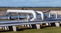 Pipeline in the background of the fire pond Royalty Free Stock Photo