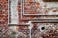 Pipeline on brick wall Royalty Free Stock Photo