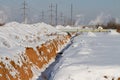 Pipeline laying in polymeric insulation in a trench dug Royalty Free Stock Photo