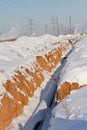 Pipeline laying in polymeric insulation in a trench dug Royalty Free Stock Photo