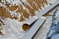 Pipeline laying in polymeric insulation in a trench dug Royalty Free Stock Photo