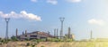 pipeline and power line support, in the photo pipeline and power line tower close-up against the background of blue sky