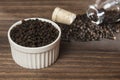 Piper nigrum - black peppercorns; photo on dark wooden background Royalty Free Stock Photo