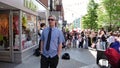 A piper plays the bagpipes windpipe for coins on street during Royal Wedding