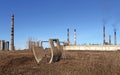 Pipes abandoned factory and smoking chimneys factory worker