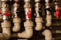 Pipes and levers controls central heating system of house Royalty Free Stock Photo