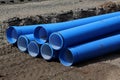 Pipes lie in a construction pit
