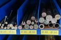 pipes, metal pieces and various metal parts for a CNC machine standing on a shelf Royalty Free Stock Photo