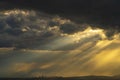 Pipes of a nuclear power plant on the background of a dramatic sky .