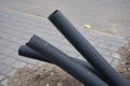 Pipes protrude from the pavement,unfinished construction of underground corrugated pipes, unburied pipes lie Royalty Free Stock Photo