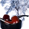 Pipes and tobacco smoke Royalty Free Stock Photo