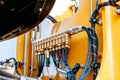 Pipes and tubes of the hydraulic system of a modern excavator tr Royalty Free Stock Photo