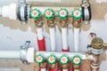 Pipes and valves for hot and cold water in a heating and water supply system Royalty Free Stock Photo