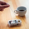 A pipette of coffee dripping into a device for measuring the percentage of total mineralization Royalty Free Stock Photo