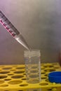 Pipette transferring liquid into 50 ml tube under steril condition