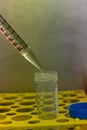 Pipette transferring liquid into 50 ml tube under steril condition