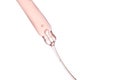 Pipette with a viscous pink cosmetic close-up.