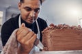 Piping, kitchen and man baking a cake with chocolate or pastry chef preparing a recipe at a bakery. Food, dessert and Royalty Free Stock Photo