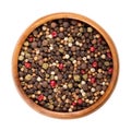Piquant peppercorn mix, spicy mixture for the pepper mill, in a wooden bowl Royalty Free Stock Photo