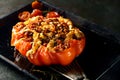 Piquant stuffed roasted ripe red tomato