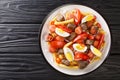 Pique macho is a Bolivian dish consisting of a layer of french fries buried underneath a heap of chopped beef, sausages, eggs, Royalty Free Stock Photo