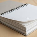 Piral-bound notebook open on an unwritten page, resting on a Royalty Free Stock Photo