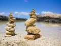Piramide stack of zen stones near sea and blue sky Royalty Free Stock Photo