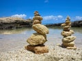 Piramide stack of zen stones near sea and blue sky Royalty Free Stock Photo