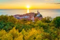 Piran Old Town, Slovenia, scenic cityscape with medieval architecture, church, sea and sky at sunset, outdoor travel background Royalty Free Stock Photo